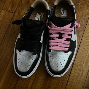 Low Jordan 1s silver, black and white. Black and pink laces.